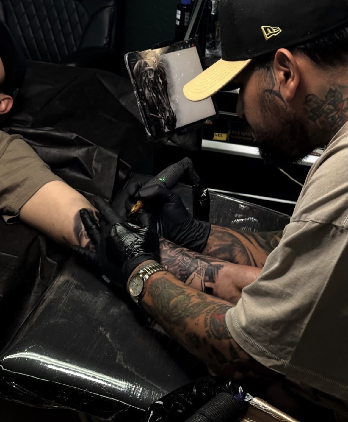 Ernesto Torres tattooing a client in his Ventura County studio