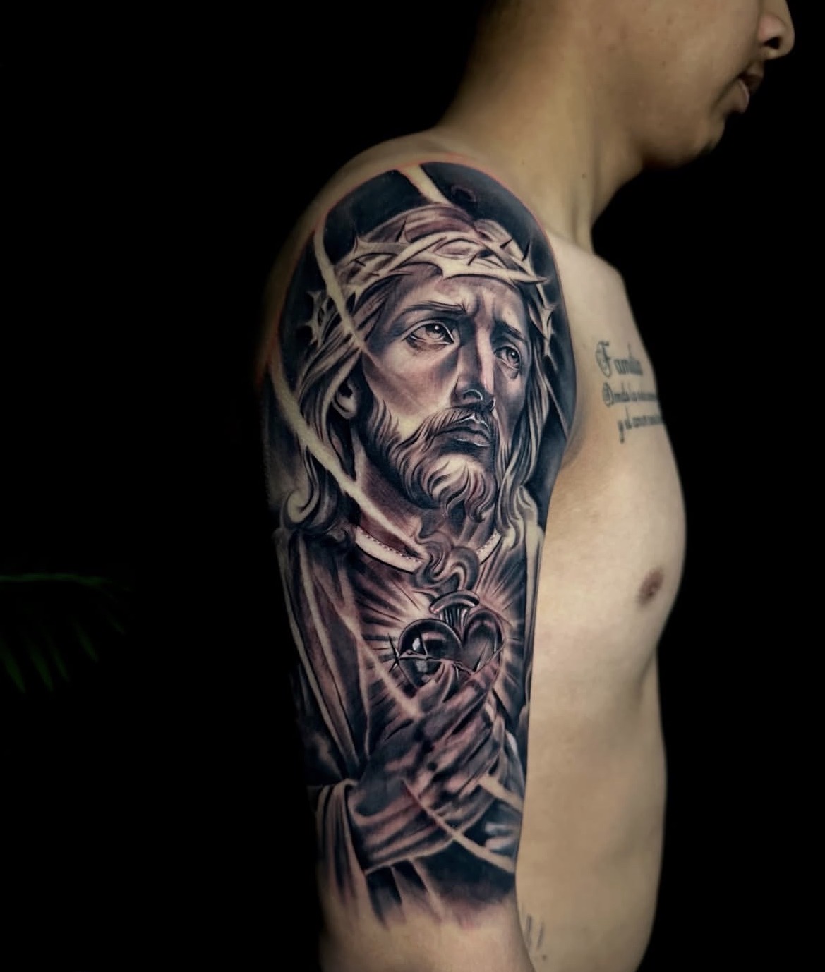 Sacred Heart Jesus black and grey realism sleeve tattoo by Ernesto Torres